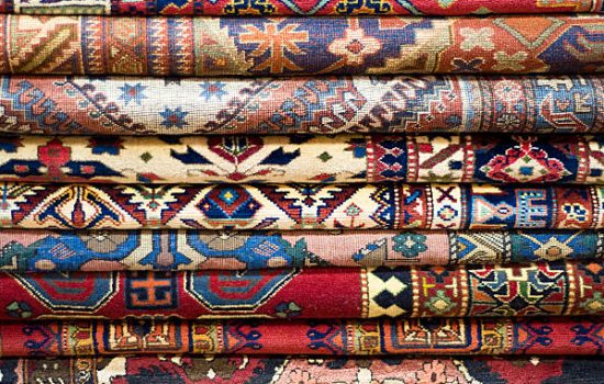 A background of fine Asian rugs.